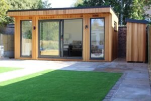 Modern bespoke garden rooms in Essex featuring cedar cladding and glass doors by Timber Construction Essex LTD